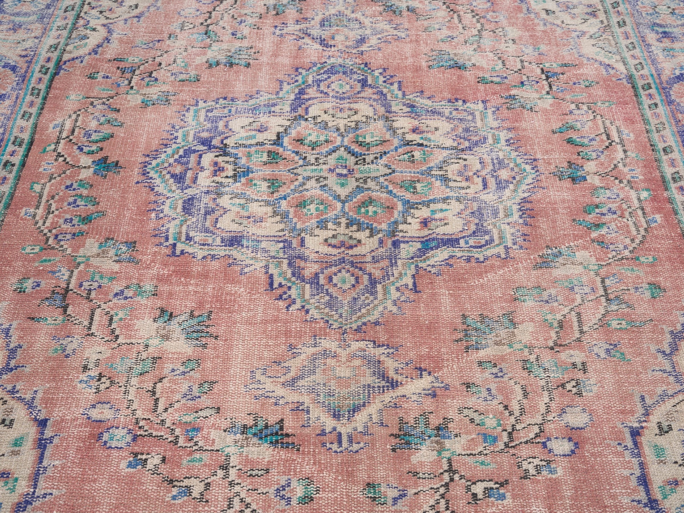 Turkish Manisa area rug in muted pink and navy, view 4 of 10