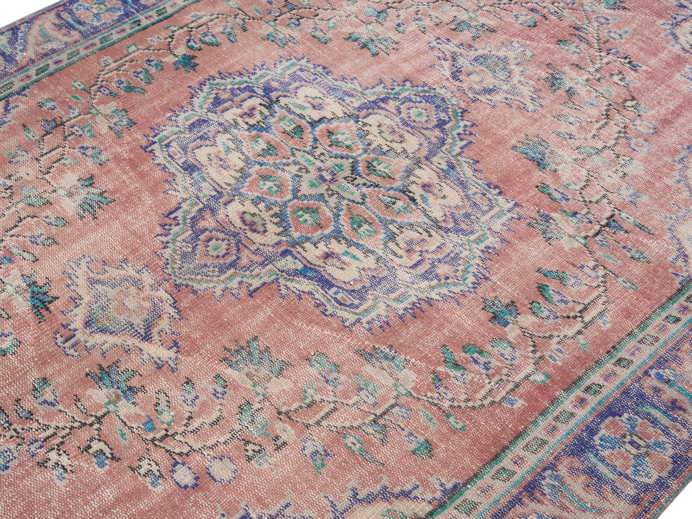 Turkish Manisa area rug in muted pink and navy, view 5 of 10