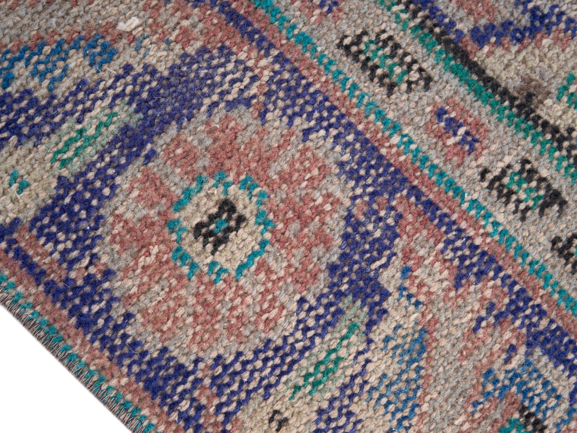 Turkish Manisa area rug in muted pink and navy, view 6 of 10