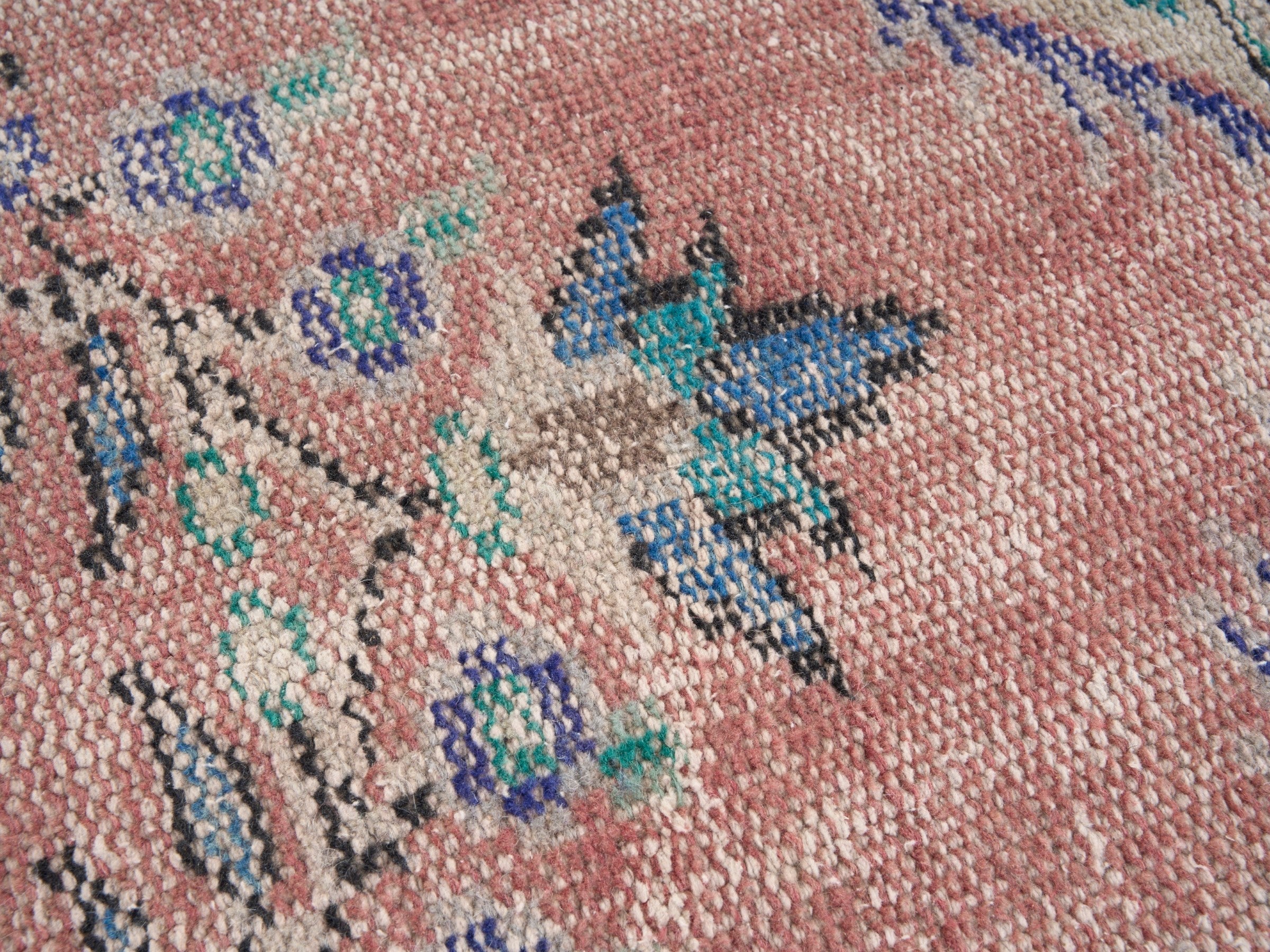 Turkish Manisa area rug in muted pink and navy, view 7 of 10
