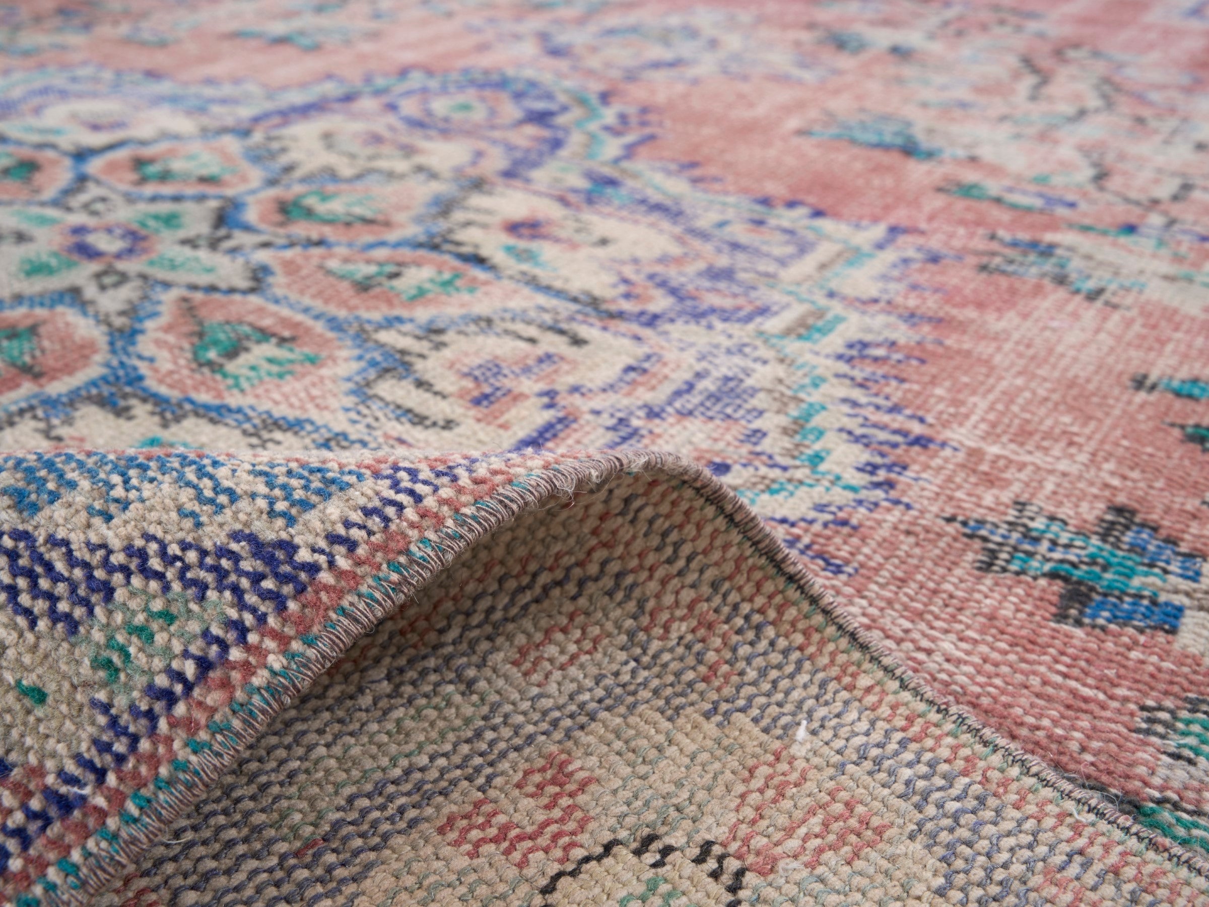 Turkish Manisa area rug in muted pink and navy, view 9 of 10