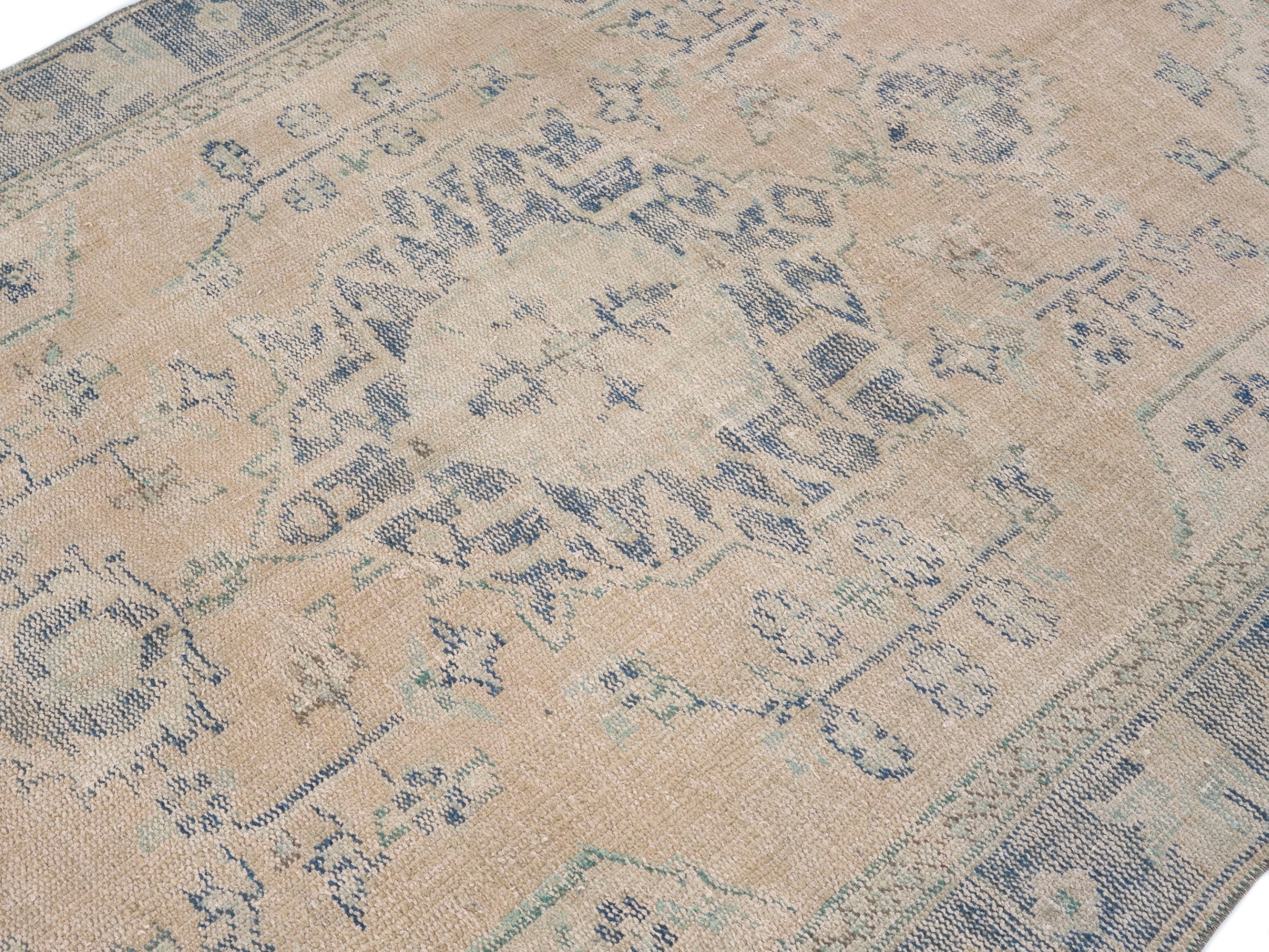 Turkish Manisa area rug in tan and slate blue, view 5 of 10