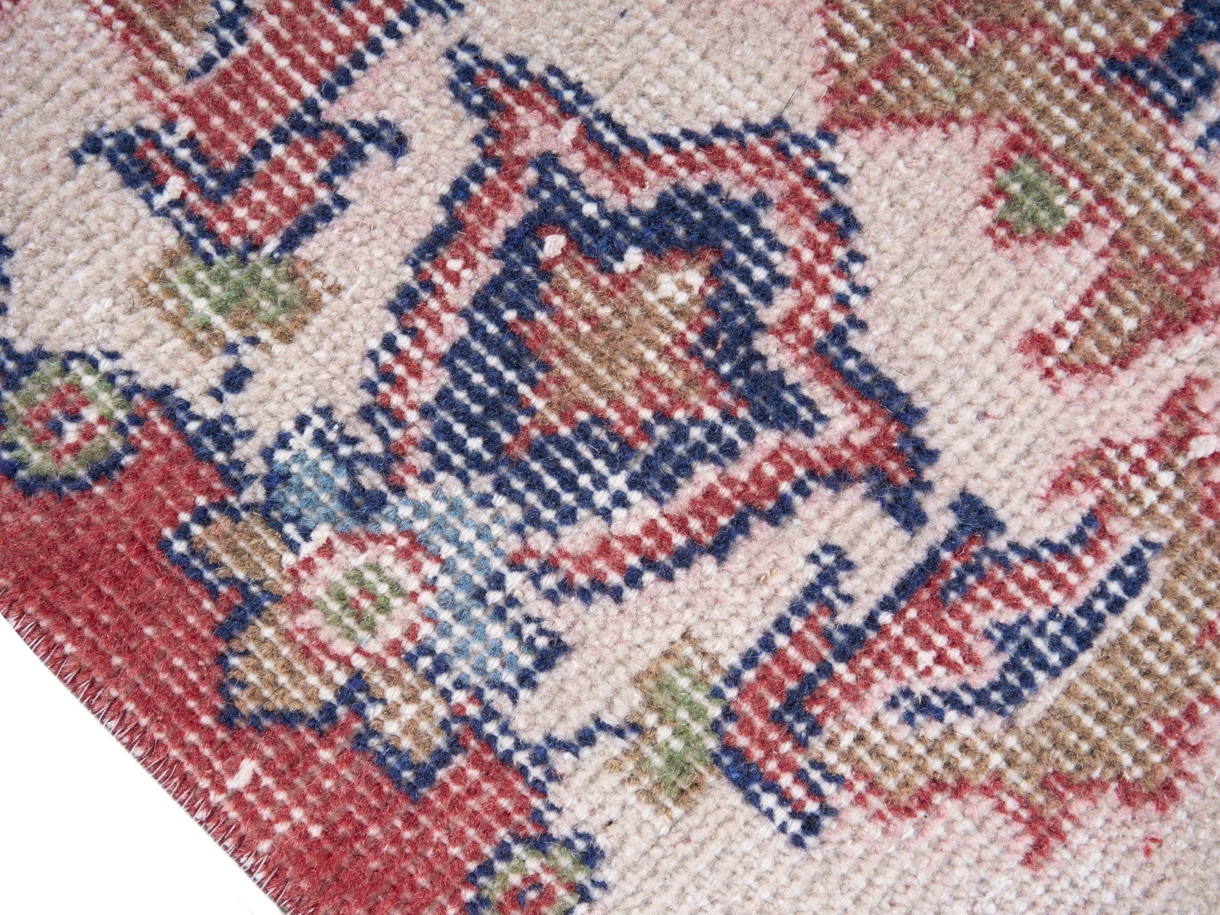Turkish Isparta area rug in dusty rose and off-white, view 7 of 10