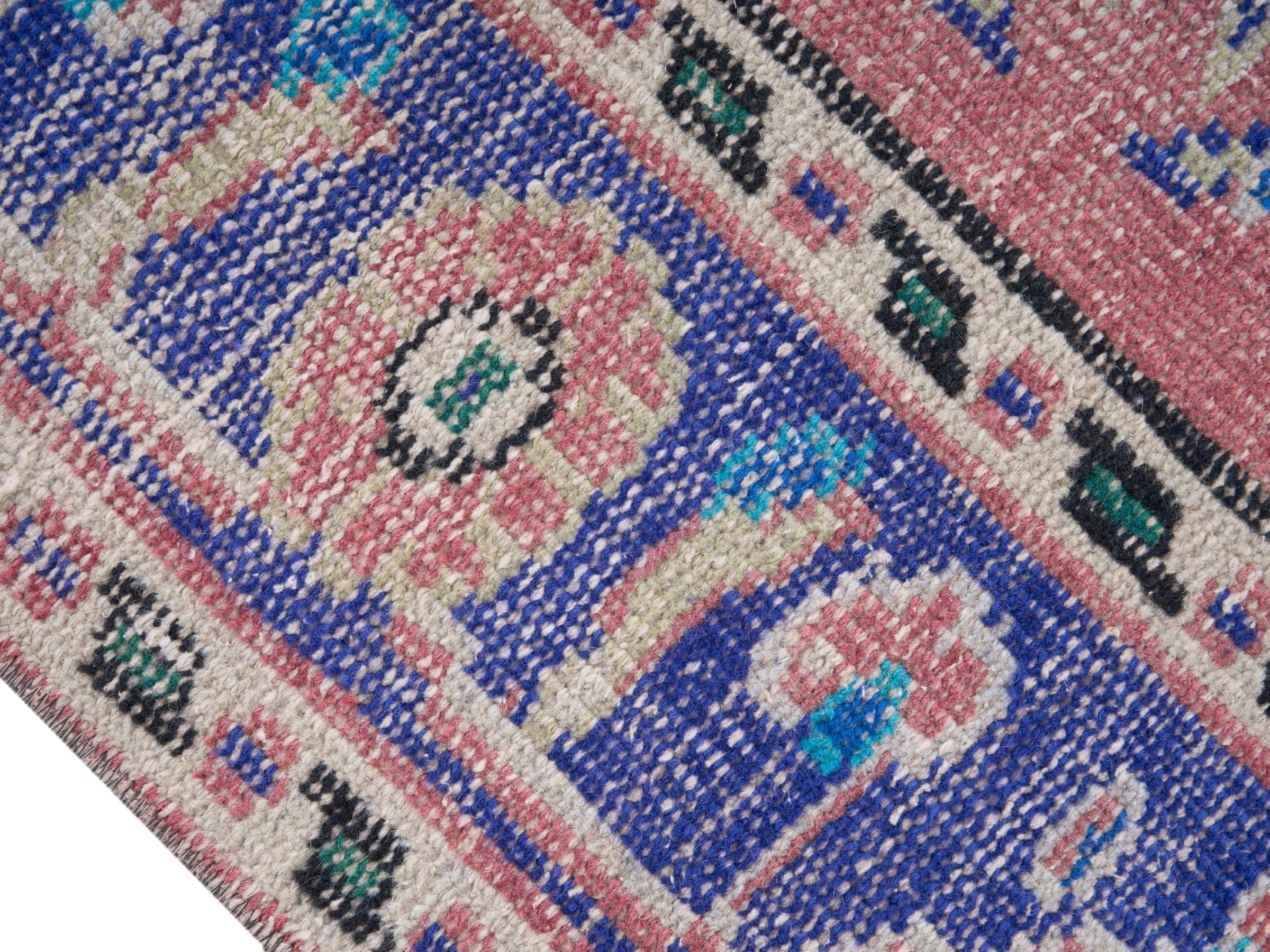 Turkish Manisa area rug in muted pink and slate blue, view 6 of 10