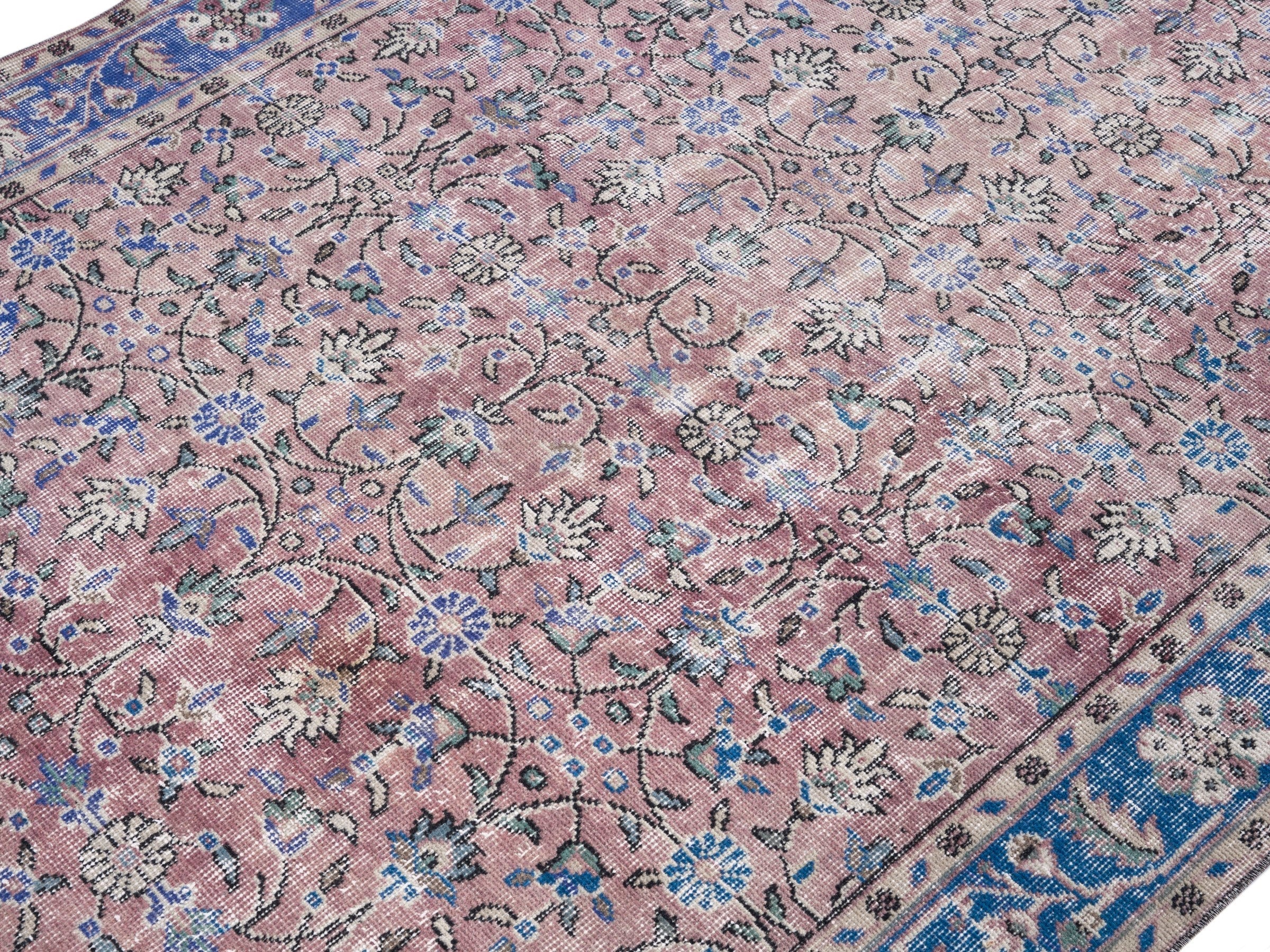 Turkish Isparta area rug in muted pink and dark blue, view 5 of 10