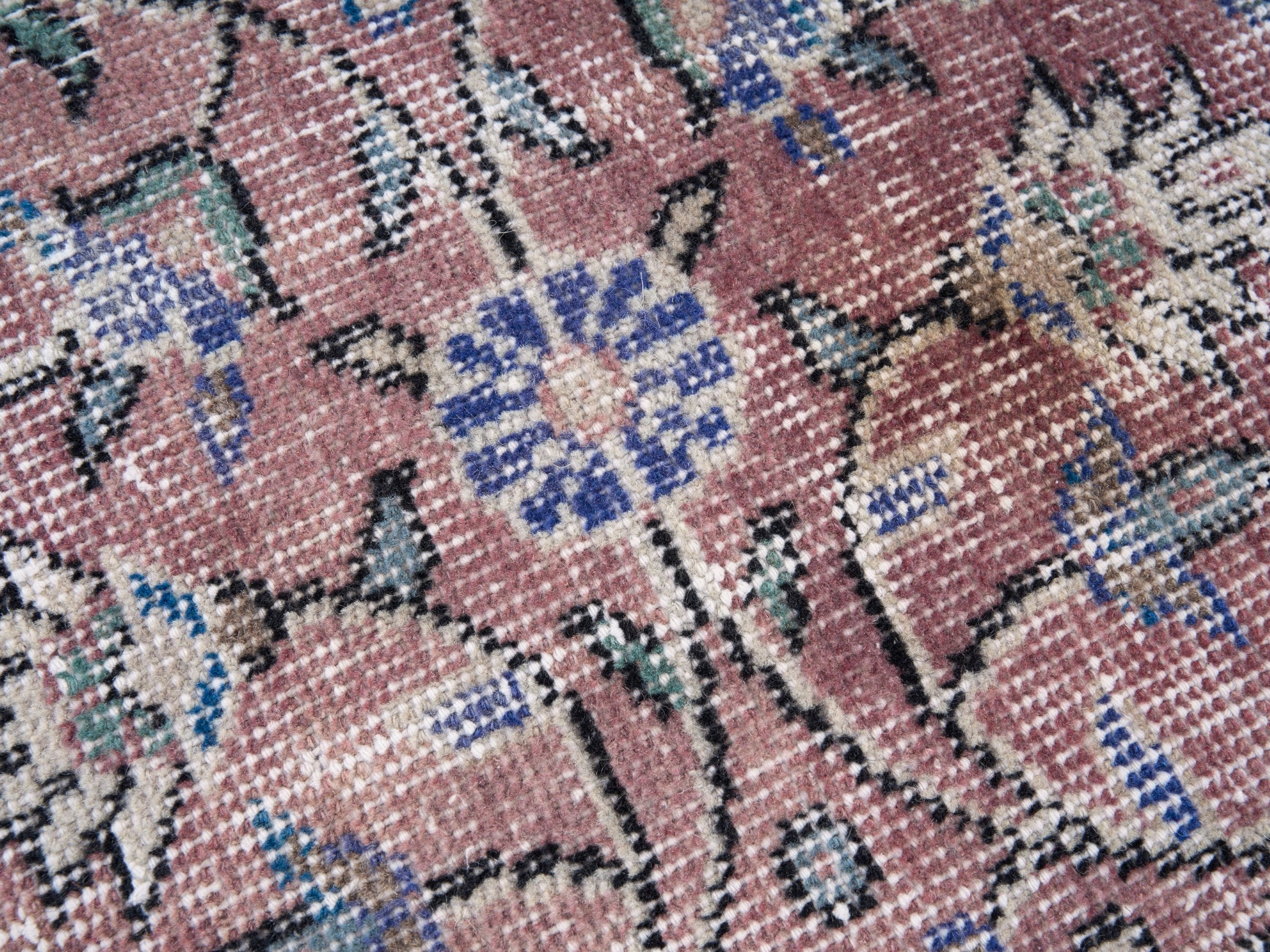 Turkish Isparta area rug in muted pink and dark blue, view 7 of 10