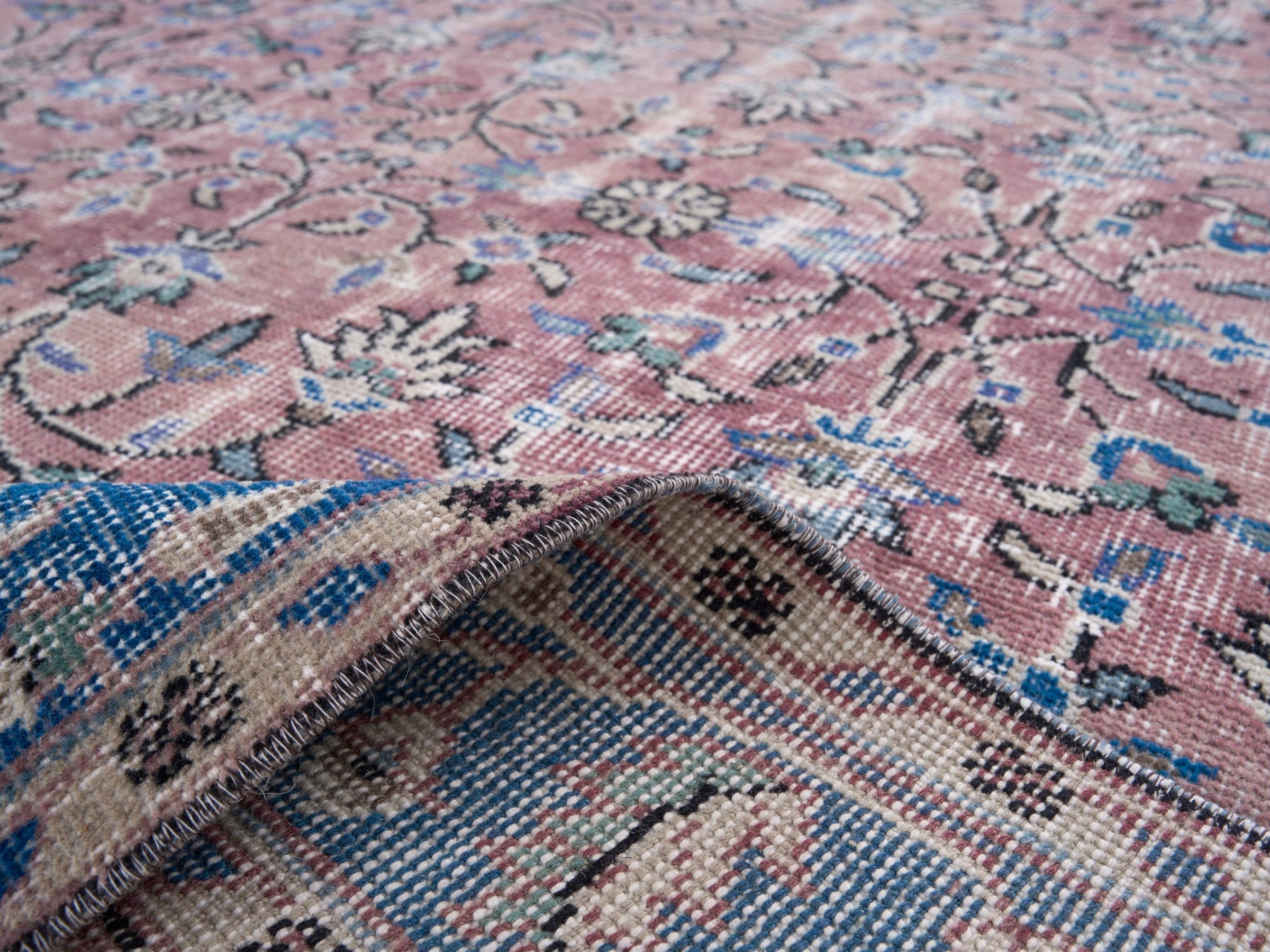 Turkish Isparta area rug in muted pink and dark blue, view 9 of 10
