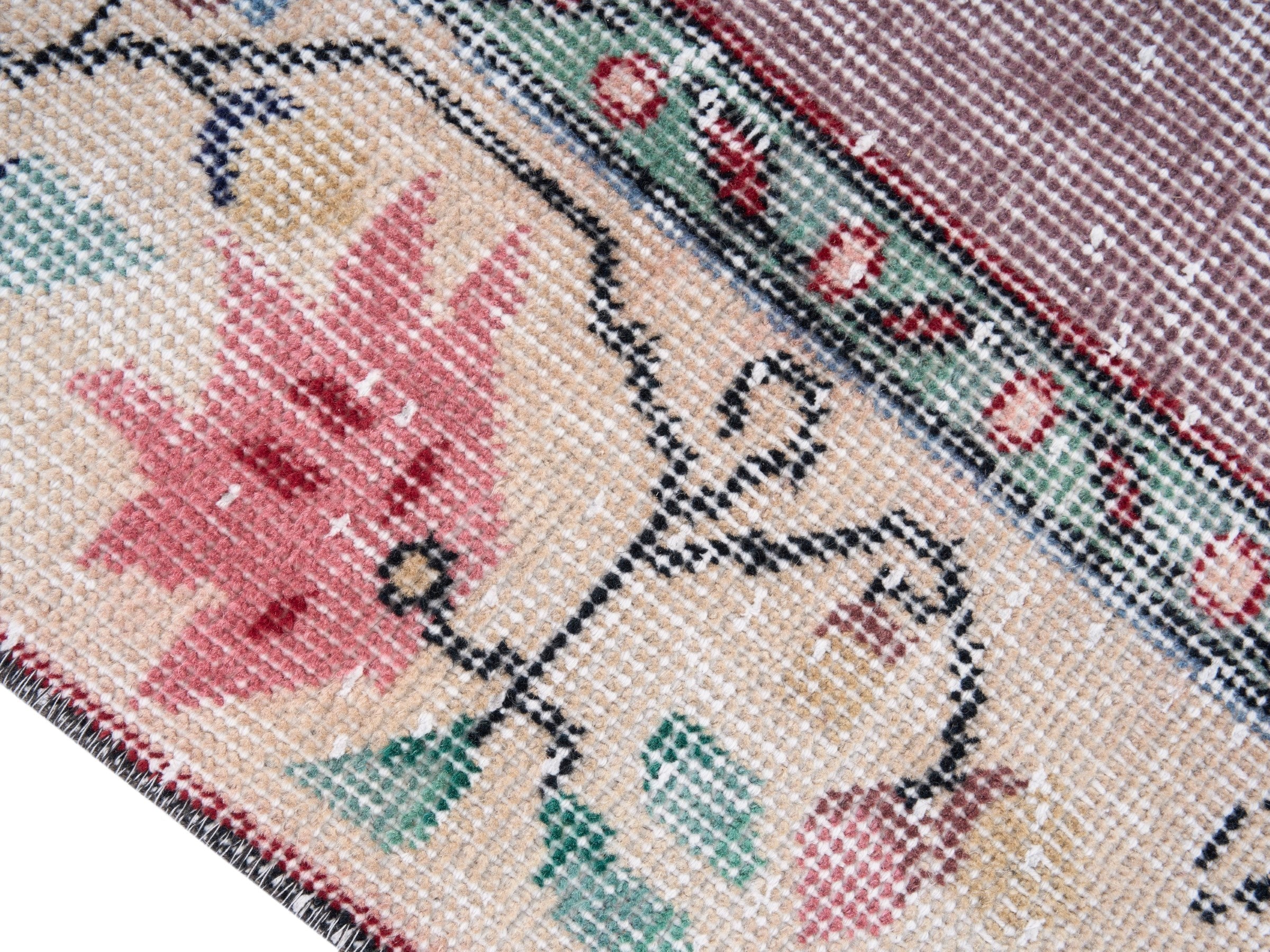 Turkish Isparta area rug in dusty rose and muted pink, view 6 of 10