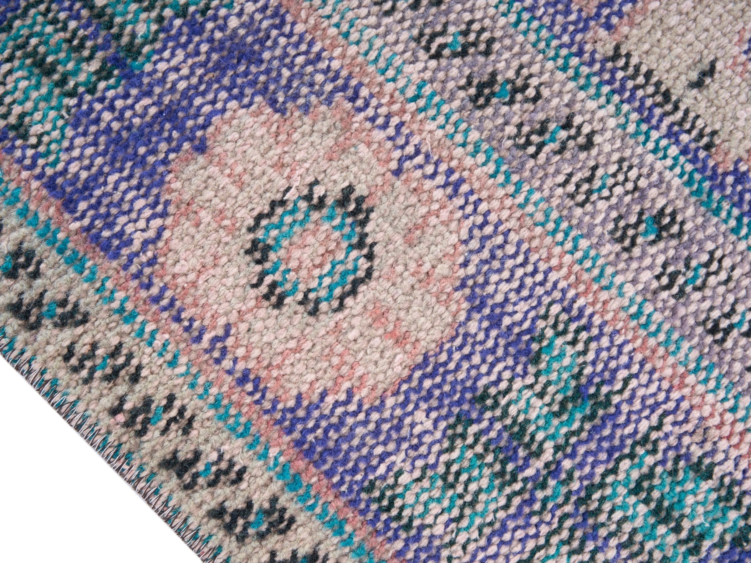 Turkish Manisa area rug in dusty rose and slate blue, view 6 of 10