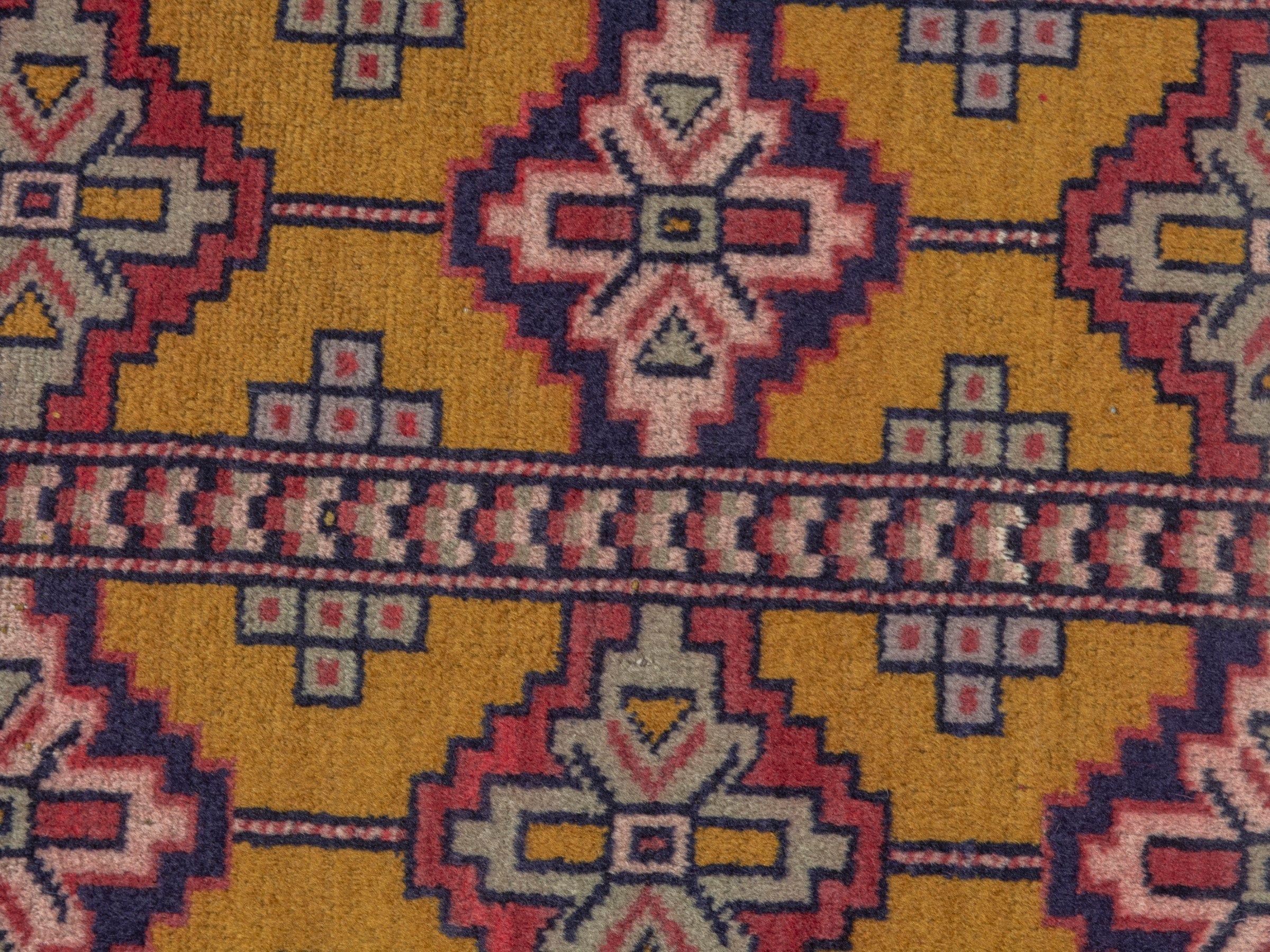 Persian Torkaman accent rug in mustard and burgundy, view 6 of 7
