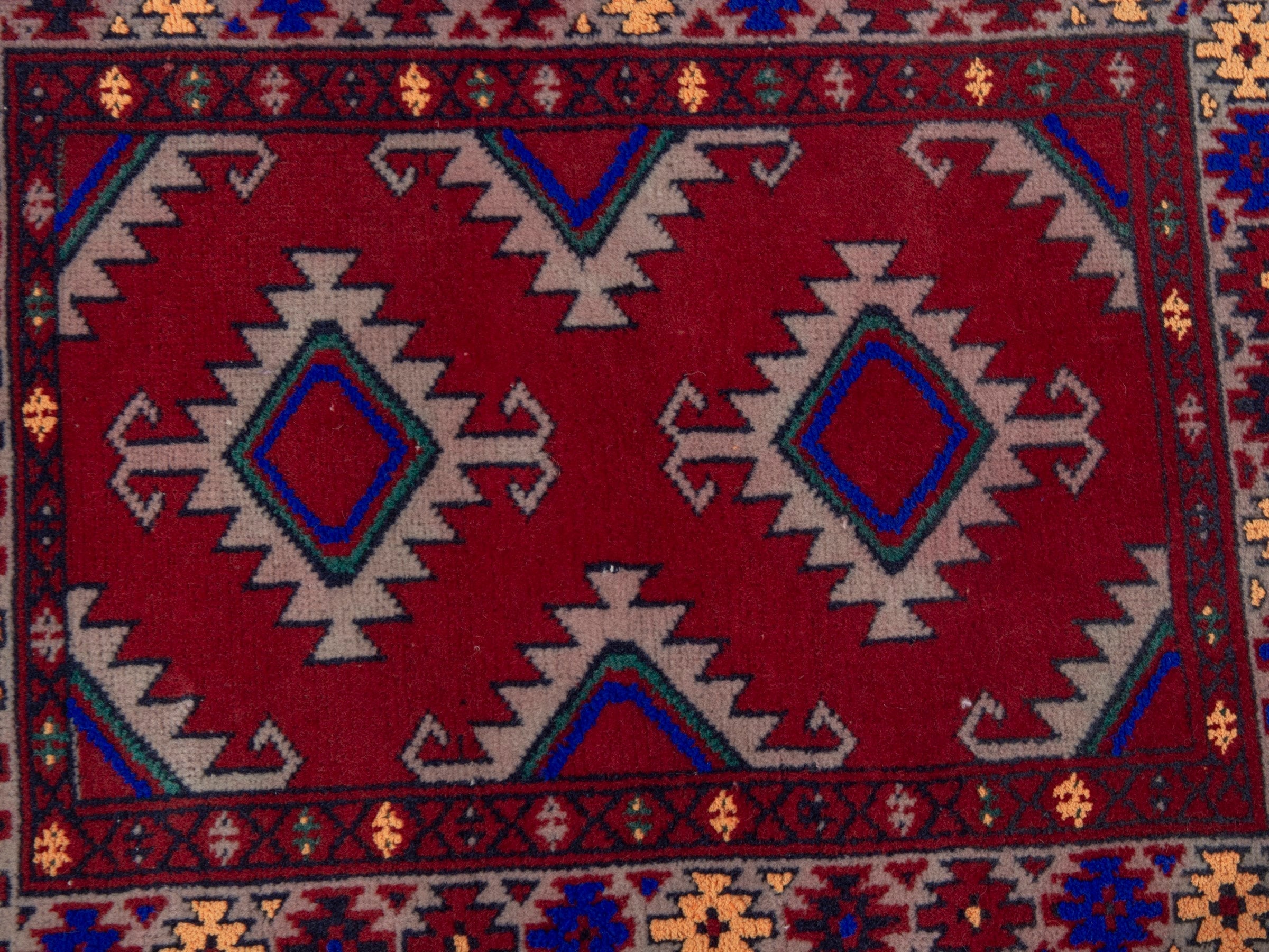 Persian Torkaman accent rug in deep red and burgundy, view 6 of 7