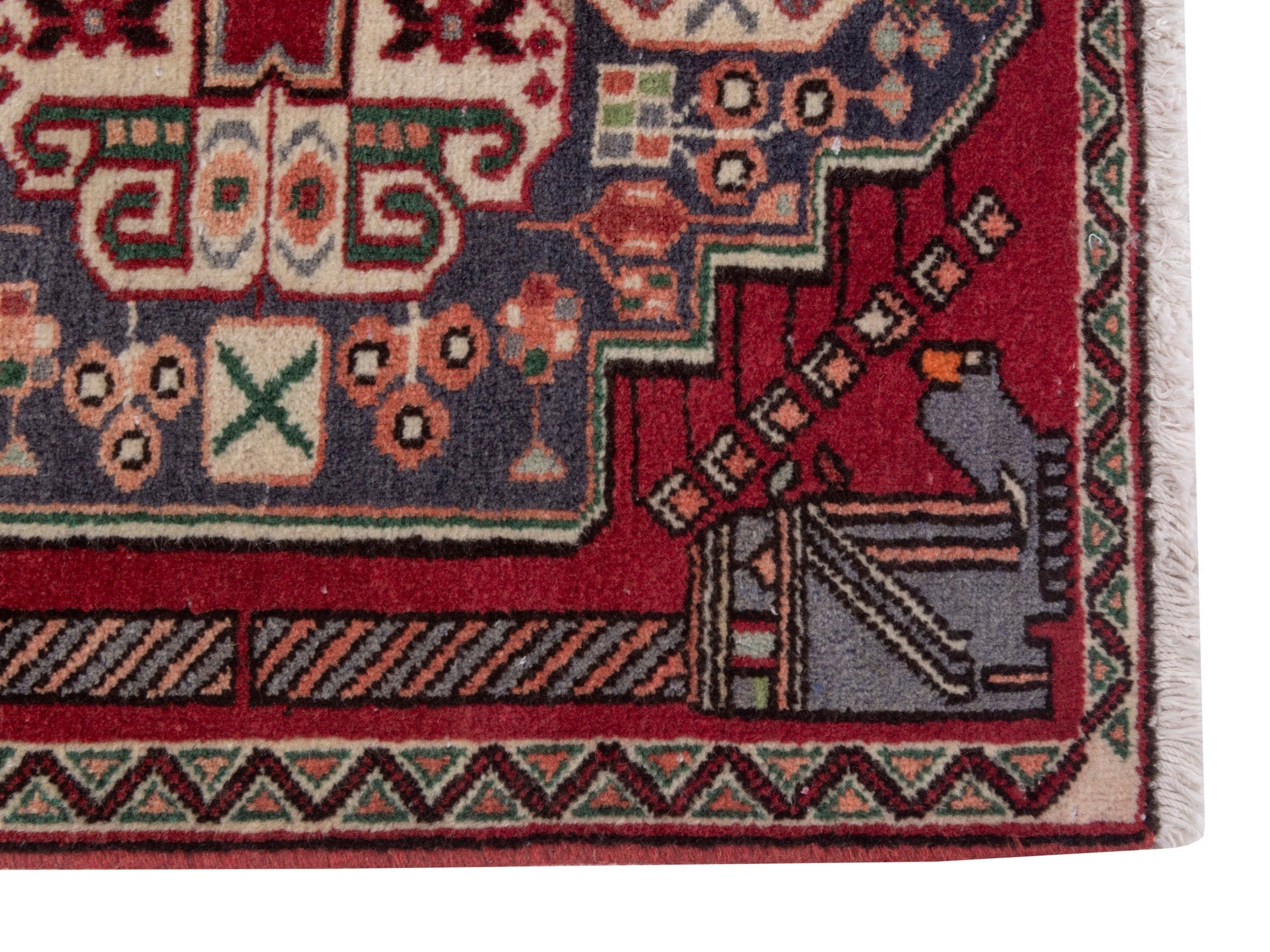 Persian Shiraz accent rug in deep red and navy, view 4 of 7