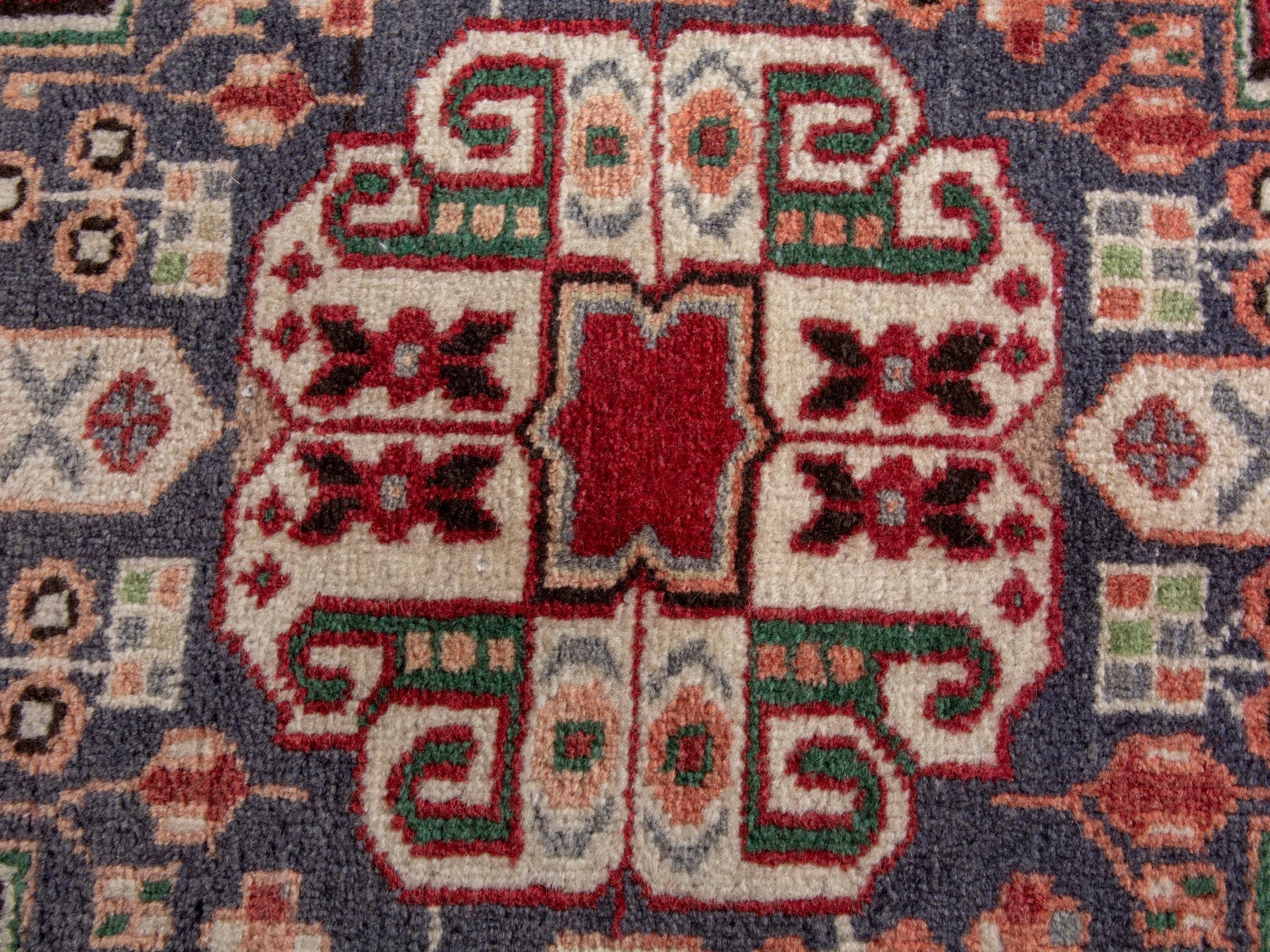 Persian Shiraz accent rug in deep red and navy, view 6 of 7