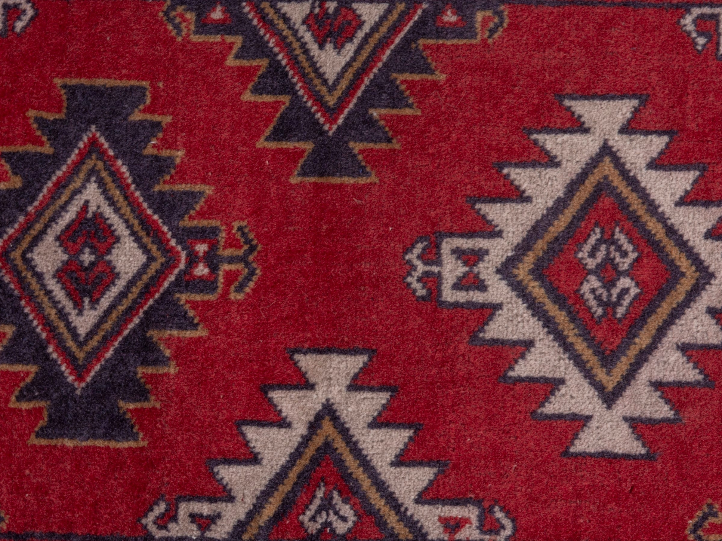 Persian Torkaman accent rug in deep red and burgundy, view 6 of 7