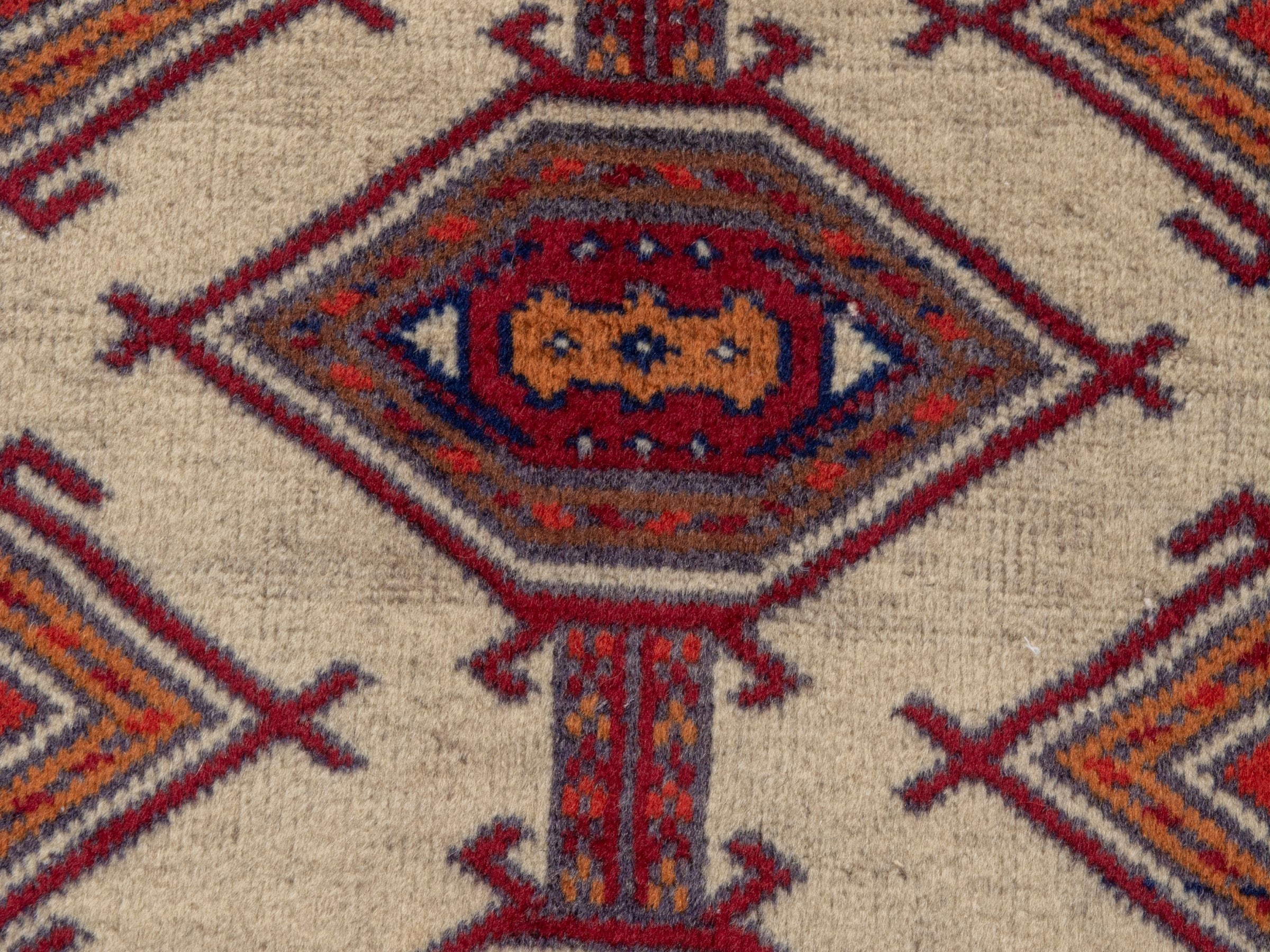 Persian Torkaman accent rug in cream and burgundy, view 6 of 7