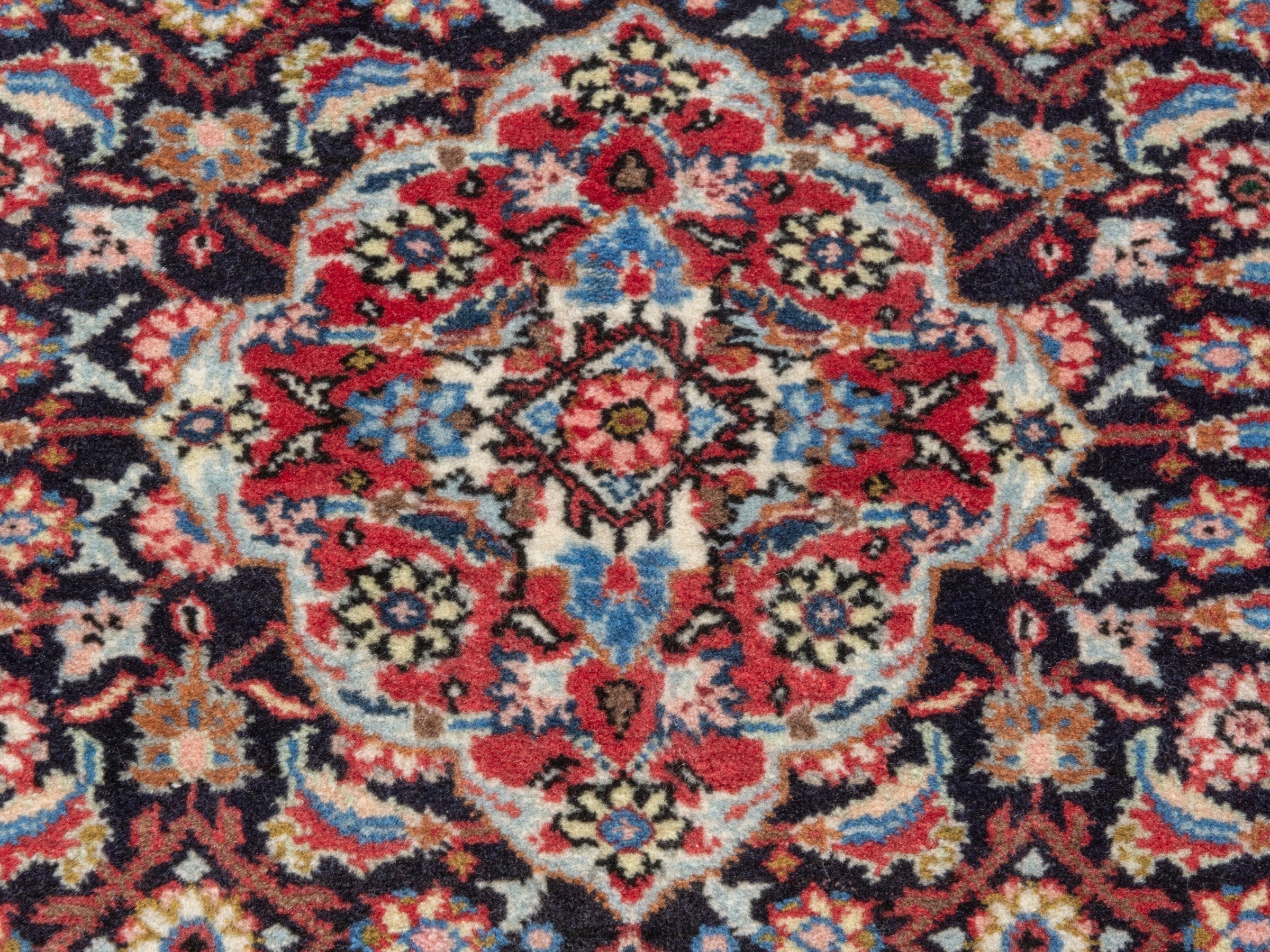 Persian Hamedan accent rug in navy and deep red, view 6 of 7