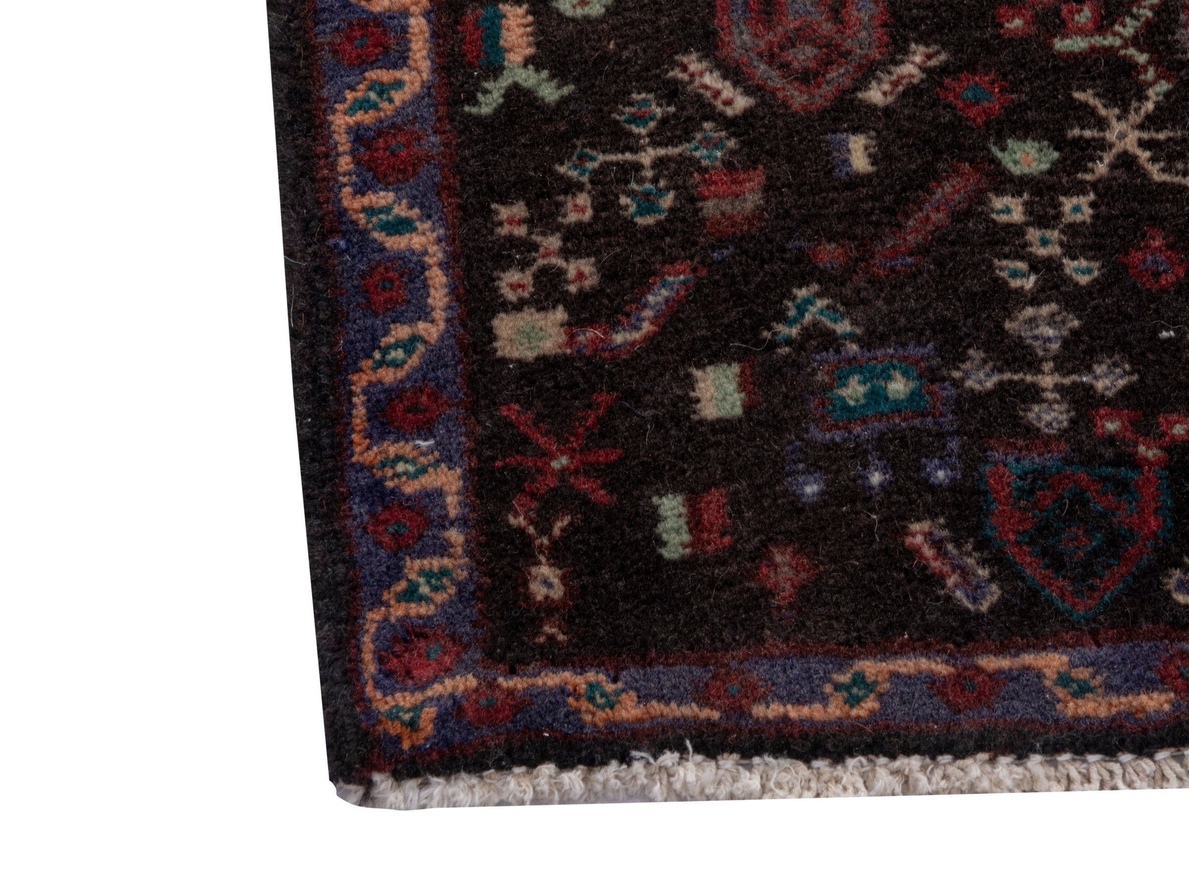 Persian Sanandaj accent rug in deep red and dark brown, view 4 of 7