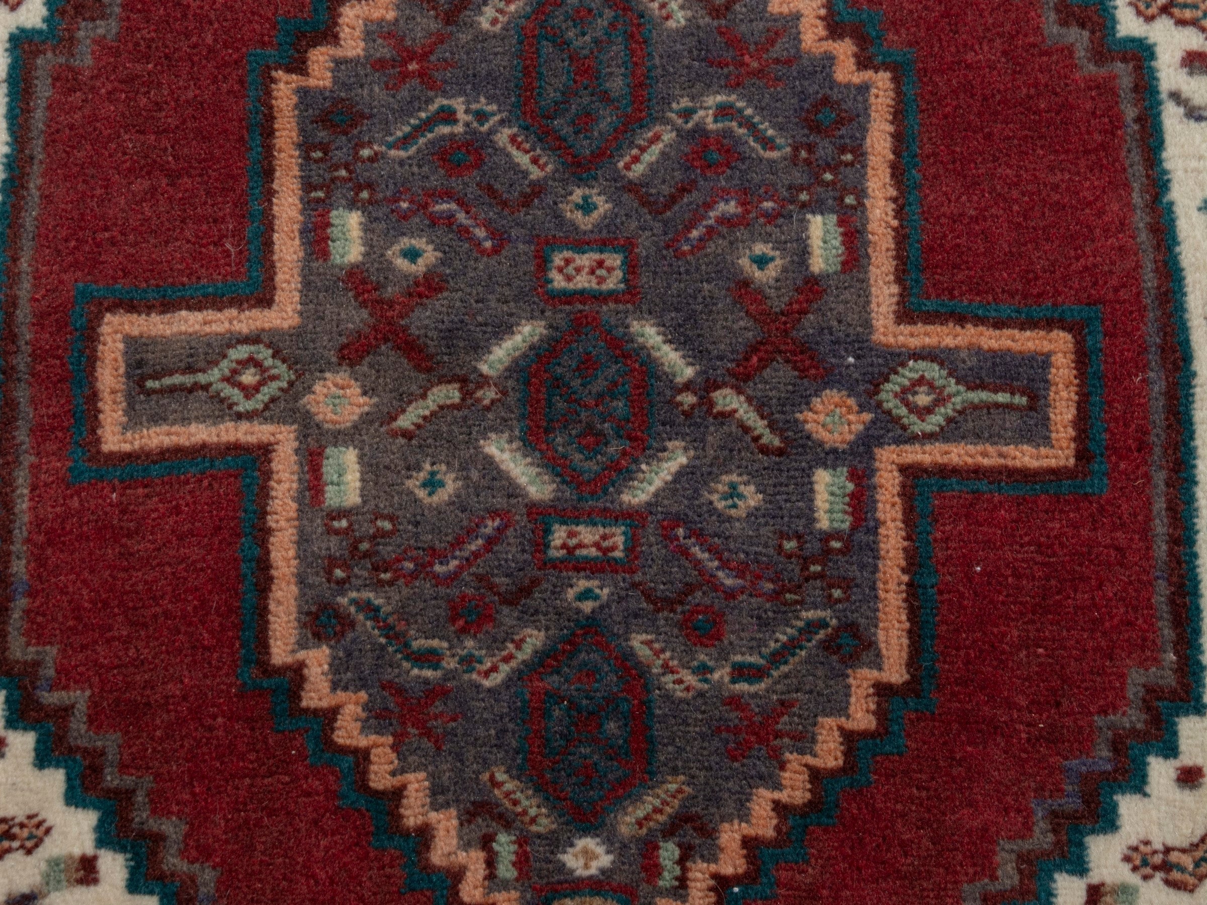 Persian Sanandaj accent rug in deep red and dark brown, view 6 of 7