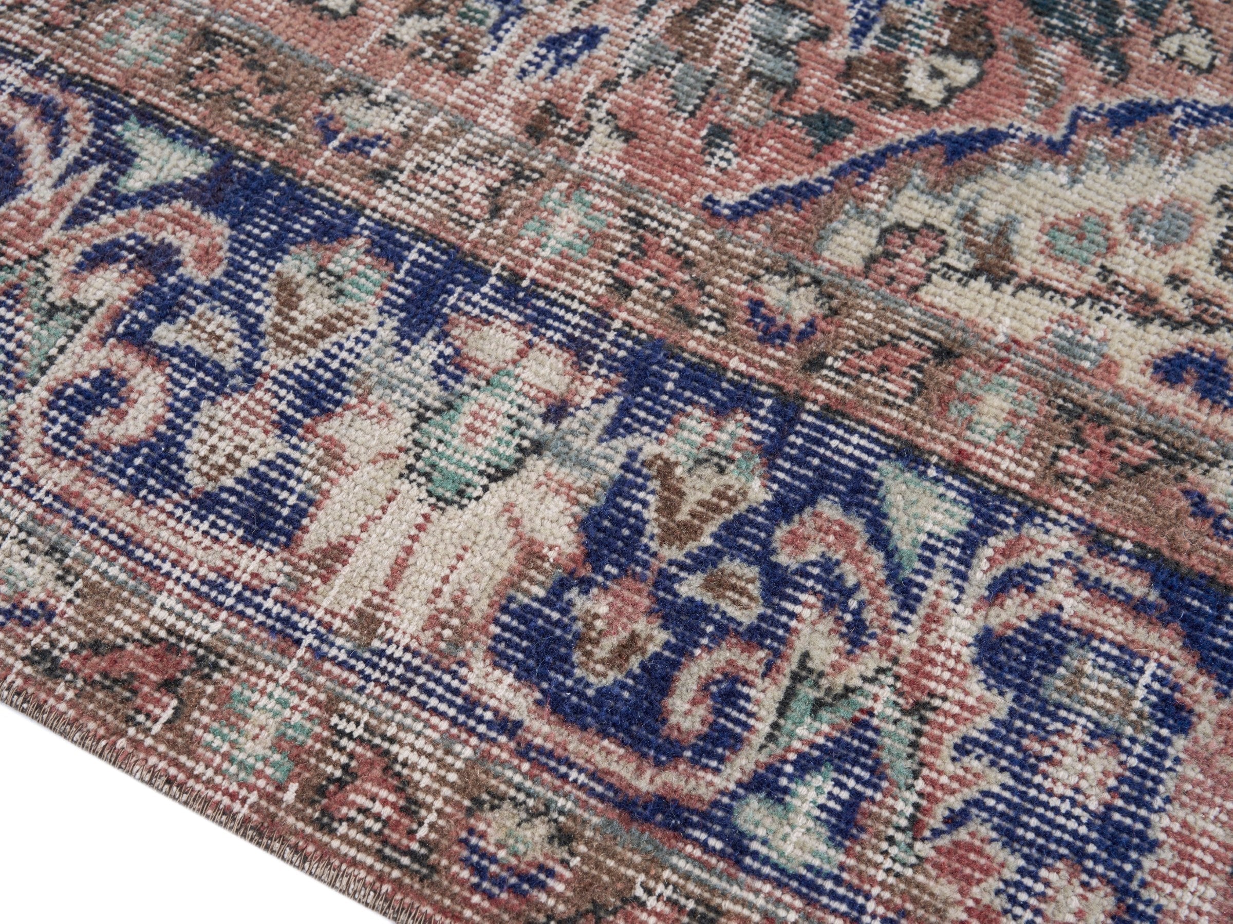 Turkish Isparta area rug in terracotta and navy, view 6 of 10