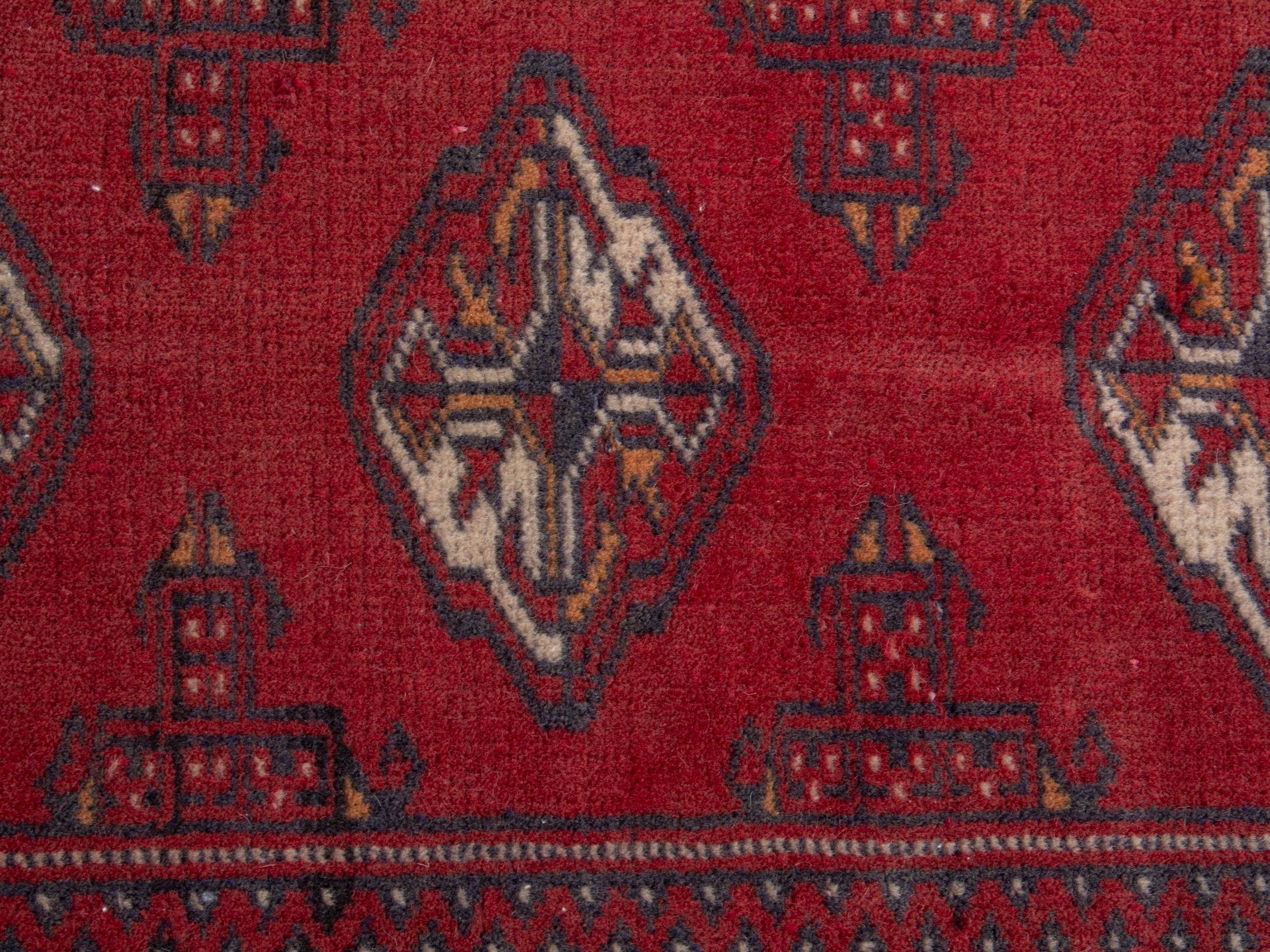 Persian Torkaman accent rug in deep red and cream, view 6 of 7