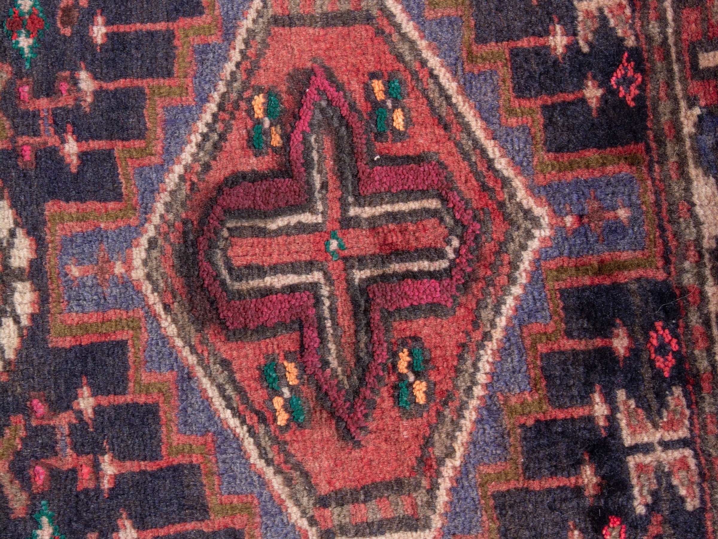 Persian Gharajeh accent rug in deep indigo and burgundy, view 6 of 7
