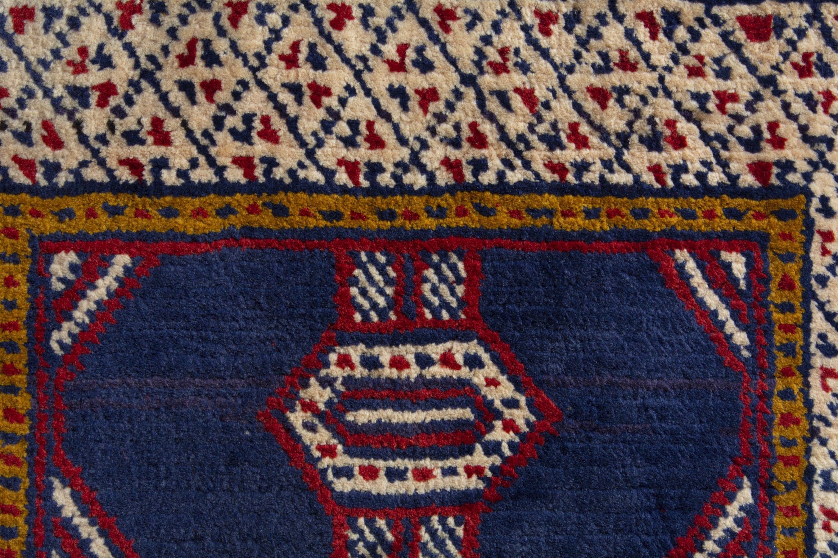 Persian Torkaman accent rug in navy and cream, view 7 of 9