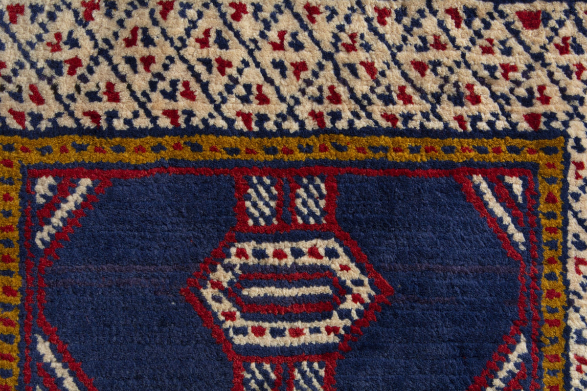 Persian Torkaman accent rug in navy and cream, view 9 of 10
