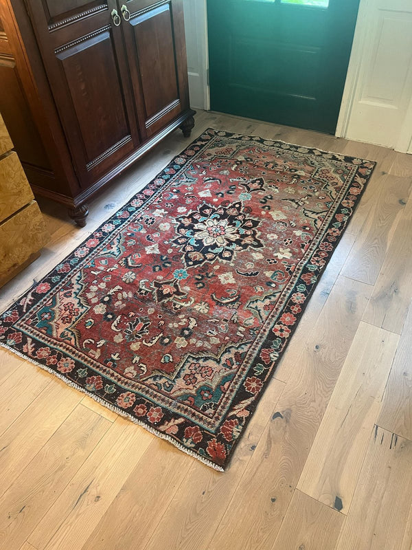 A customer's vintage rug at home